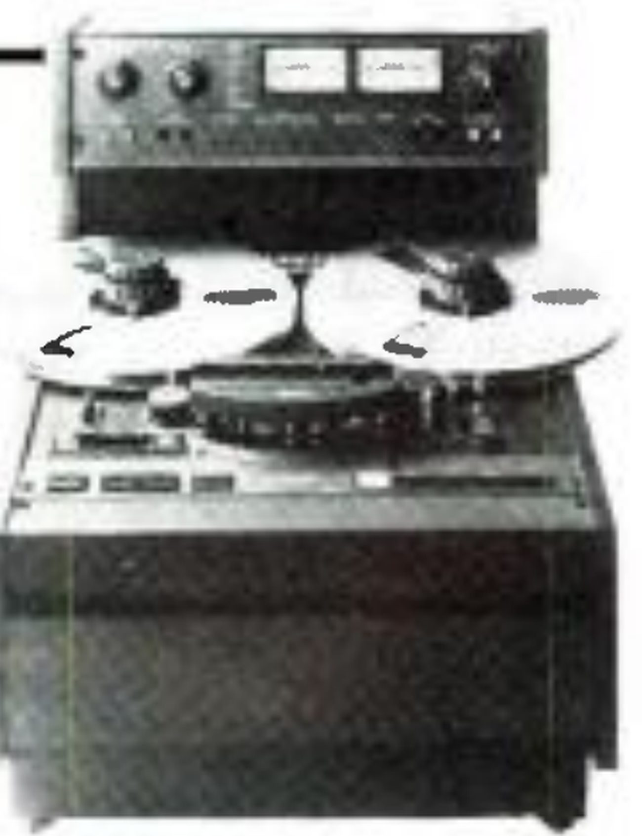 The MARK III-2 photographed from the front: the electronics panel with two VU meters and level knobs standing above the transport, two reels, the head assembly and transport buttons, and the console cabinet beneath.