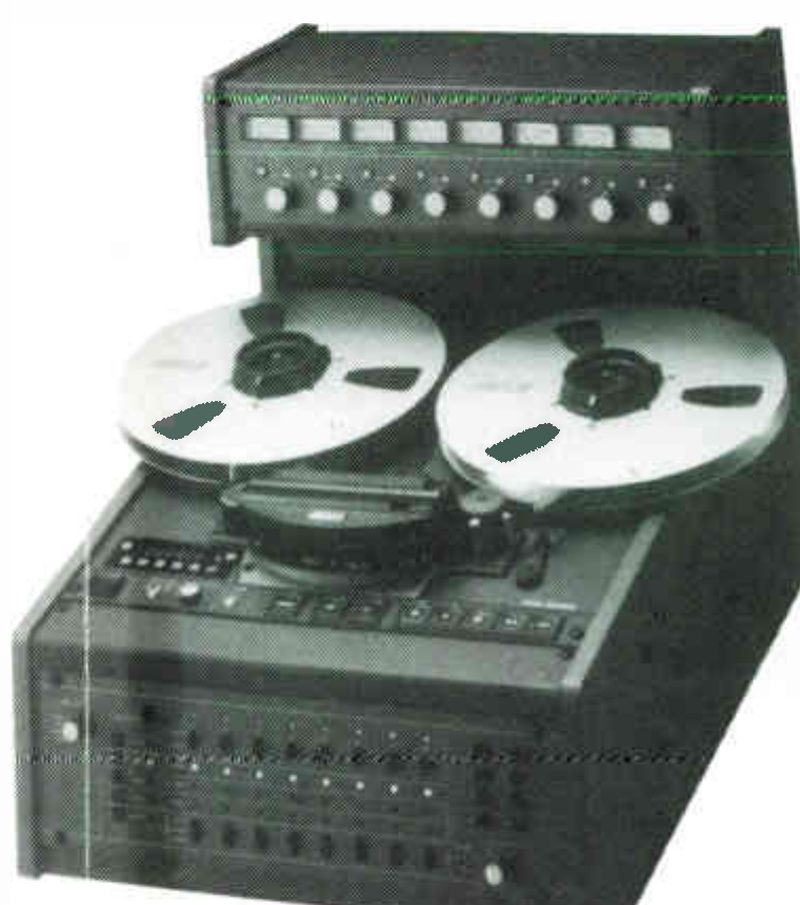 An eight-channel machine of the MX-5050 series, keyed 4 in the ad, in its console: a meter bridge with eight meters and knobs above, two reels on the transport, the head assembly under its cover, and a panel of channel switches in the console front.