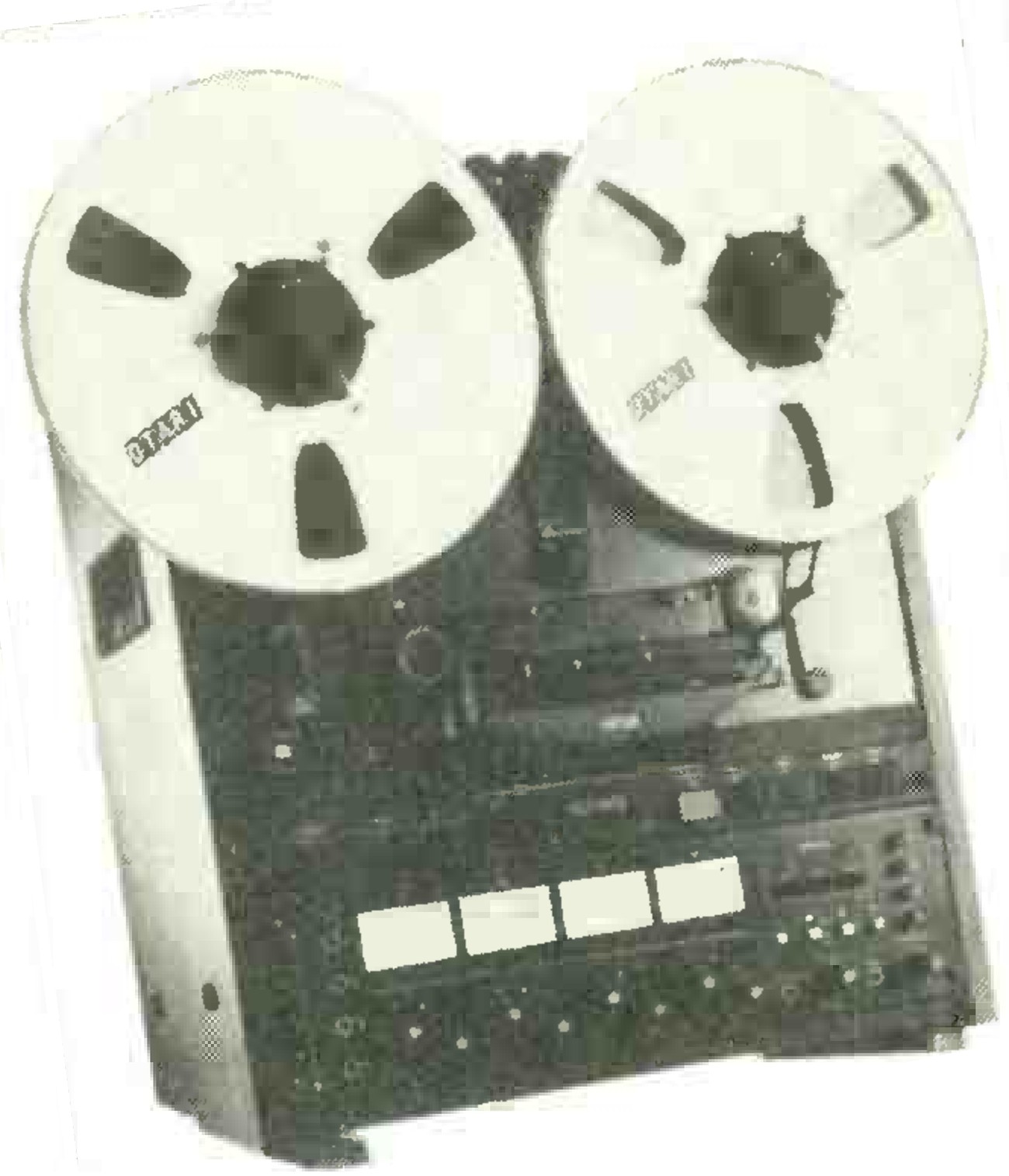 The MX5050 BQII, upright and seen from the front at a slight angle: two reels with OTARI badges, the head block under them, and the electronics below with a row of four white-faced meters.