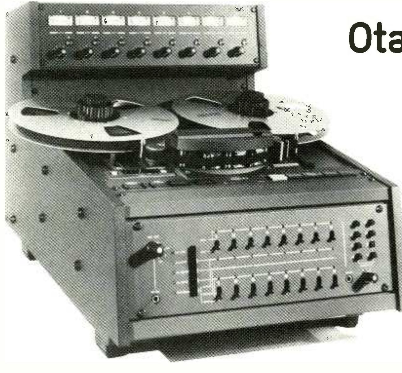 The Mark III/8 photographed from a high three-quarter angle in black and white: the eight VU meters and their level controls in the meter bridge on top, two large reels on the transport, the head block under its cover, and the sloping front panel with two rows of eight track switches, the two columns of headphone-selector buttons at right and the headphone jack; the first letters of the review's headline intrude at top right.