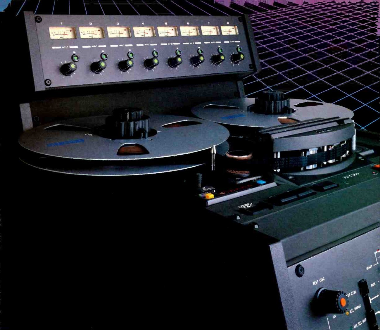 The Mark III/8 photographed close up in dark tones against a purple and blue grid: the eight-channel meter bridge with its input level knobs, two metal reels on the transport, the head block under its cover and, at lower right, the corner of the front panel with the TEST OSC selector.