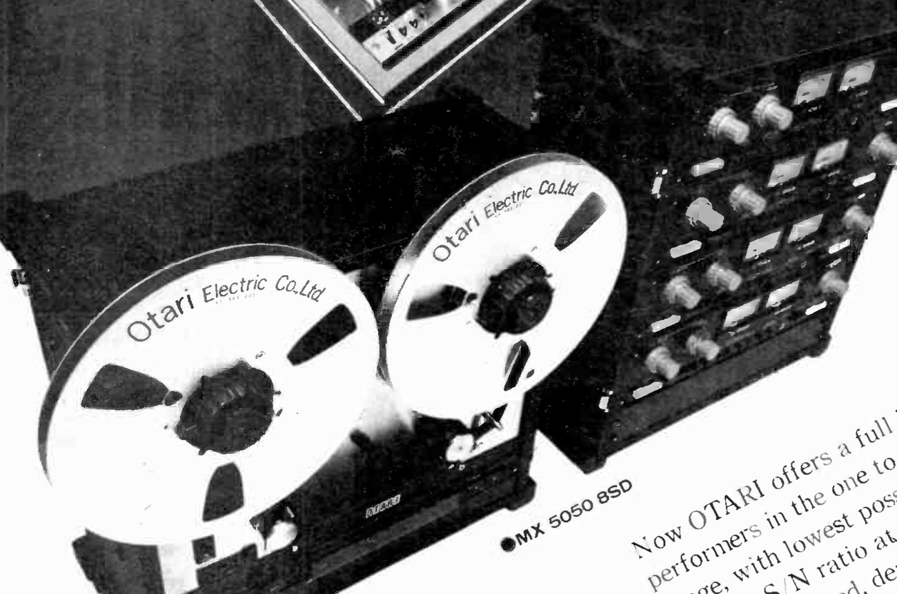 Detail of the MX 5050 8SD: the half-inch transport seen from above at an angle, with two Otari Electric Co. Ltd reels and the OTARI badge on the deck plate, and beside it the separate electronics bay, four rows of paired meters with their level knobs; the tag ●MX 5050 8SD sits below the transport.