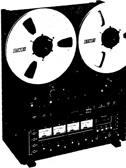 An MX-5050 BQ II tape recorder in its upright console cabinet, with two OTARI-branded 10½-inch reels above a control panel carrying four VU meters.
