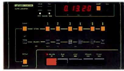 The CB-102 remote control photographed face-on: an auto-locator display showing 0.13.20 at the top right, a row of six numbered cue buttons across the middle, transport controls along the bottom with a large red Record button, and function legends screened in pale type.