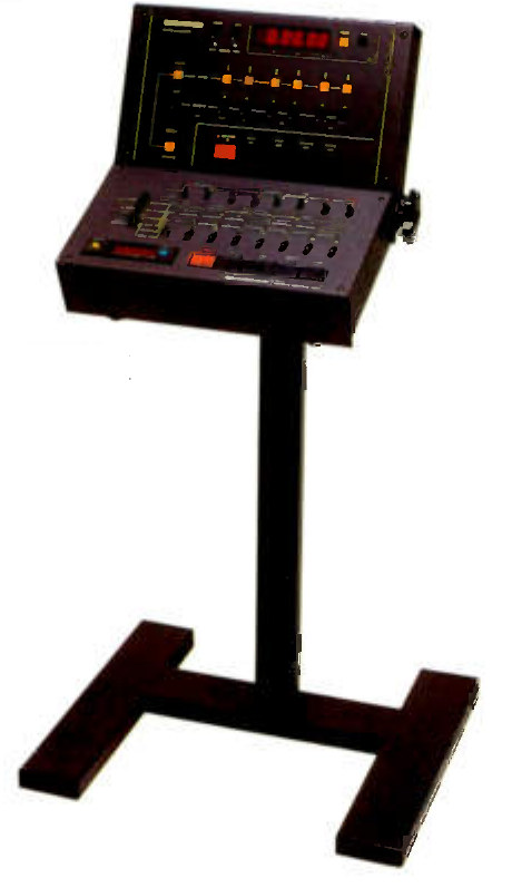 The CB-110 remote session controller on its ZA-55U floor stand: an angled top panel with a red LED time display, a row of orange channel status buttons and a large red Record button, over a lower panel of transport keys and rotary controls, the whole on a black pillar with a T-shaped base.