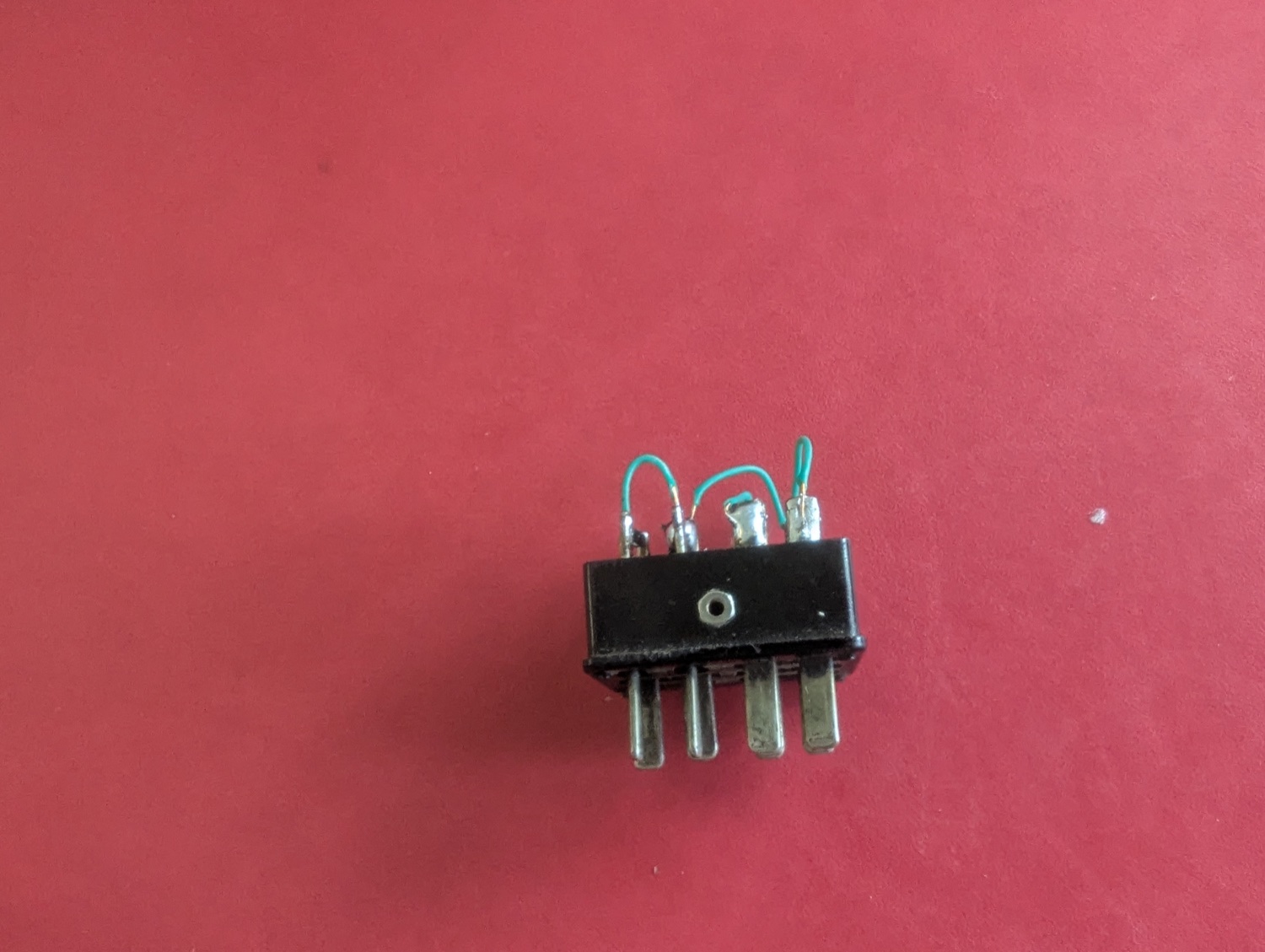 The tidy dummy plug — a vintage Cinch plug rewired with the 1–3–8–11 and 4–6 jumpers.