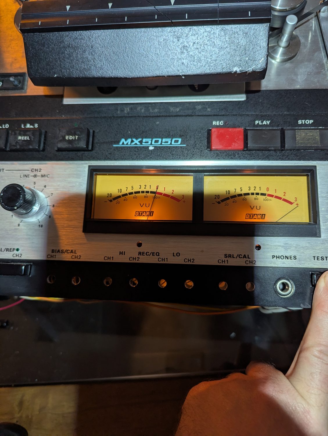 Halfway through the VU calibration: CH-1 trimmed to 0 while CH-2 still pins past +3 on the very same tone.