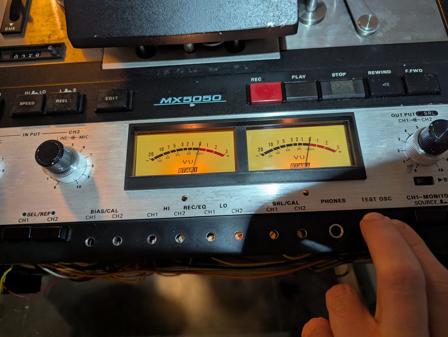 Both needles on 0 with the TEST OSC button held down — 1.23 volts at the line output, and the meters mean something again.